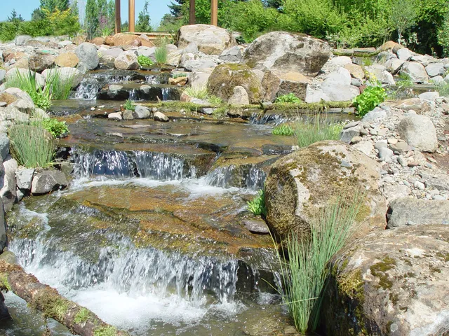 Boulder waterfall cascade with plantings
