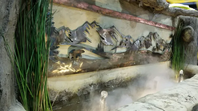Copper mountain sculpture water feature with mist