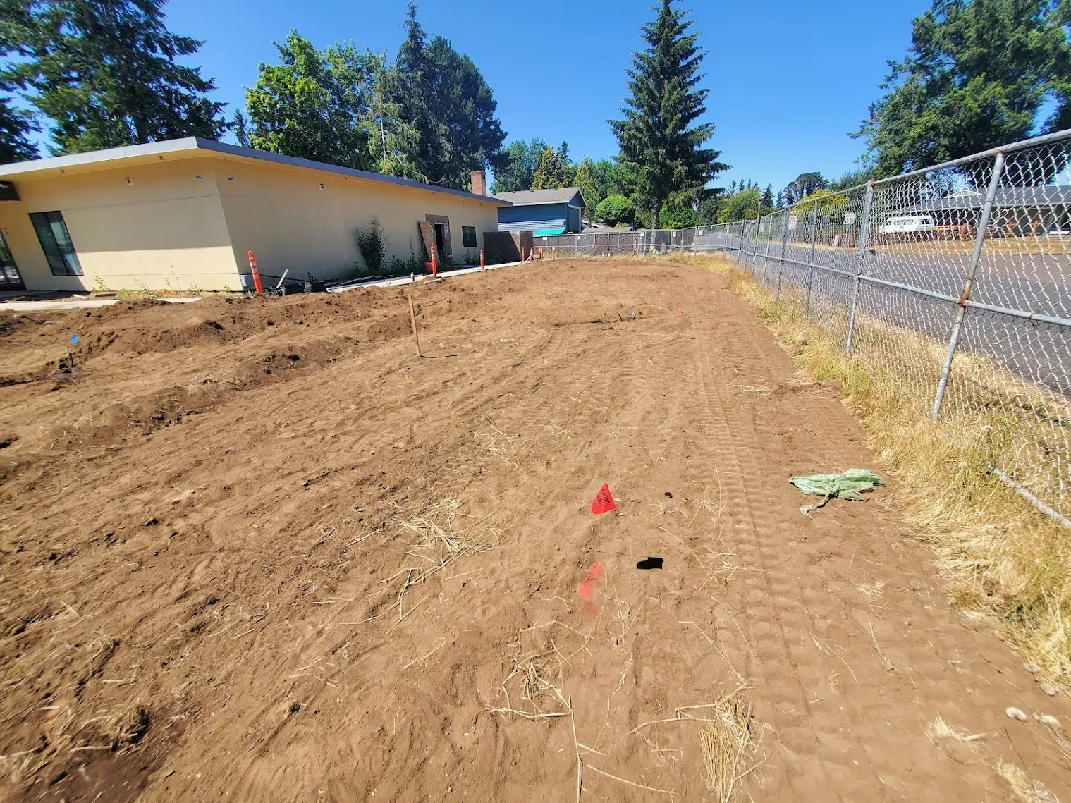 Graded bare dirt lot at a new-construction commercial site