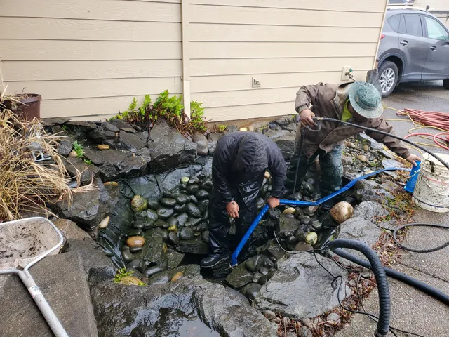 Earthworks crew performing a professional pond cleanout